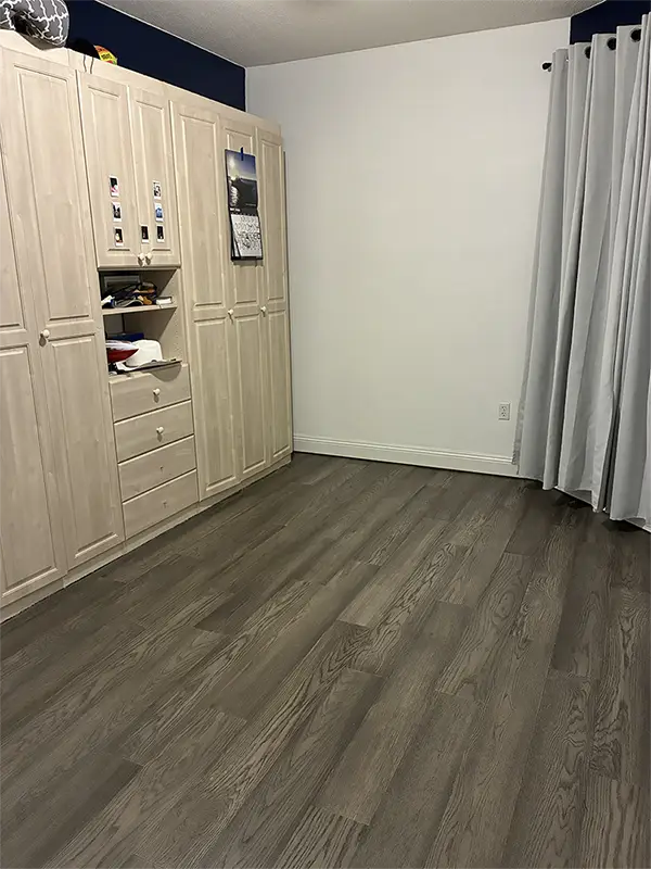 Beach front condo bedroom engineered hardward floor install carpet replacement AFTER Grunt Laborers June 2026 Beach front condo bedroom engineered hardward floor install carpet replacement AFTER Grunt Laborers June 2026